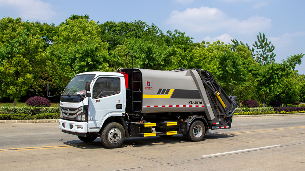 7方东风华神F3新款压缩式垃圾车（翻转板带桶杆）